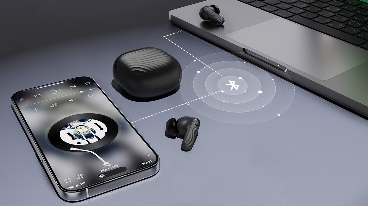 Wireless earbuds paired with both a smartphone and laptop, highlighting dual-device connectivity for versatile audio use across multiple devices.