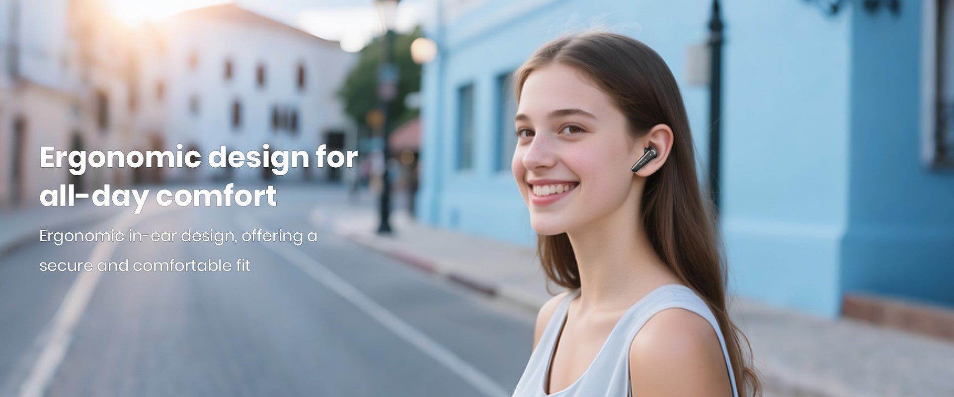 Woman wearing earbuds outdoors, highlighting ergonomic design for all-day comfort, ensuring a secure and pleasant fit for extended use.